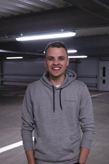 Chris Cousall standing in a car park portrait.